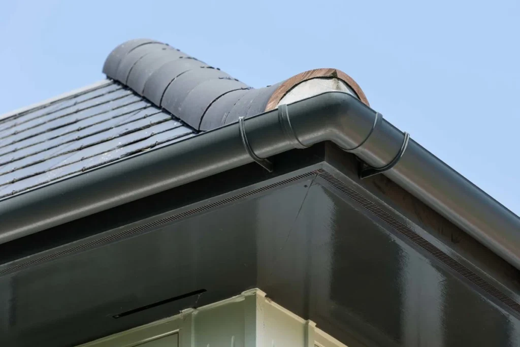 Comparison of aluminum vs copper gutters, highlighting the affordability and durability of aluminum gutters for budget-conscious homeowners.